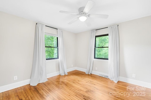 7022 Lakeside Dr, Charlotte, NC 28215 - spare room with baseboards, light wood-type flooring, and ceiling fan