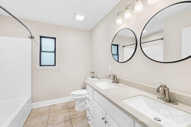 7022 Lakeside Dr, Charlotte, NC 28215 - full bath featuring tile patterned floors, shower / washtub combination, double vanity, toilet, and baseboards