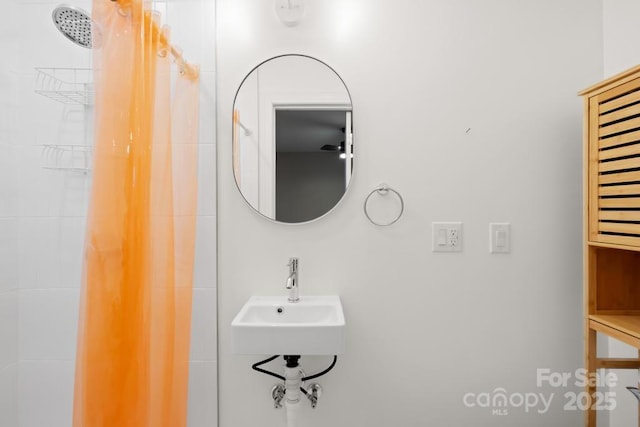 7022 Lakeside Dr, Charlotte, NC 28215 - bathroom featuring a sink and a shower with shower curtain