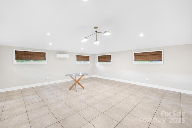 7022 Lakeside Dr, Charlotte, NC 28215 - spare room with a wall mounted AC, plenty of natural light, baseboards, and recessed lighting