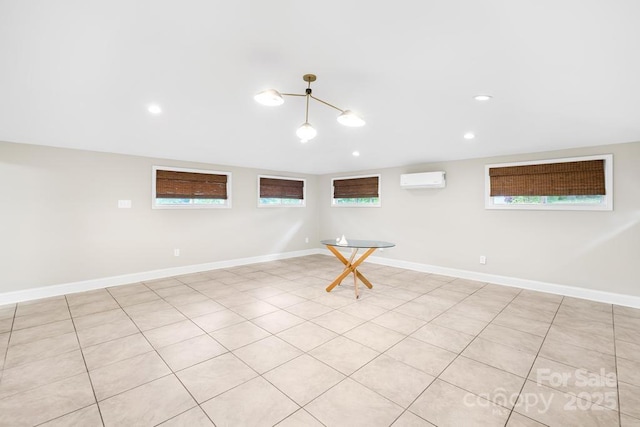 7022 Lakeside Dr, Charlotte, NC 28215 - basement with plenty of natural light, a wall unit AC, baseboards, and recessed lighting