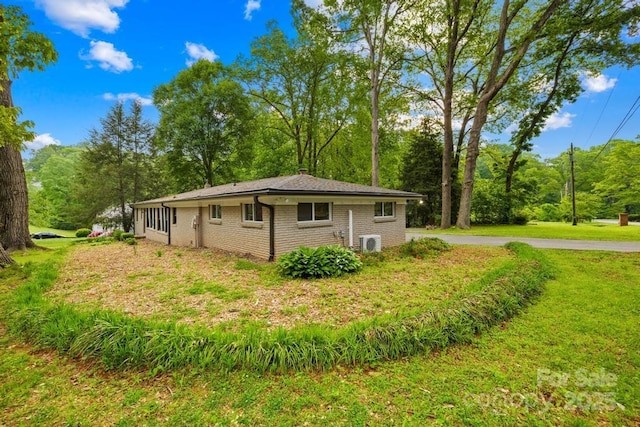 7022 Lakeside Dr, Charlotte, NC 28215 - view of side of property with a lawn and brick siding