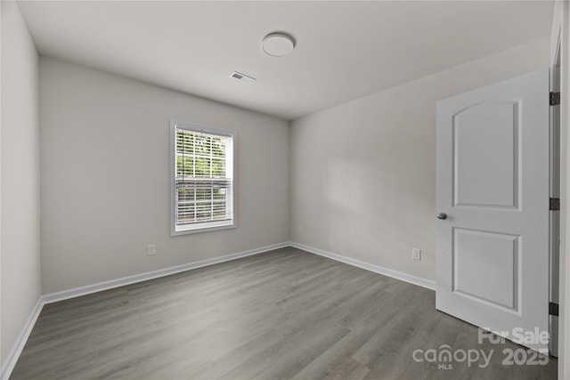 1723 Rhyneland Cir, Gastonia, NC 28054 - spare room featuring wood finished floors and baseboards