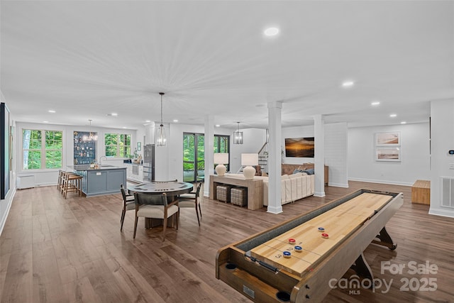 117 Walking Horse Trl, Davidson, NC 28036 - rec room with recessed lighting, wood finished floors, and a chandelier