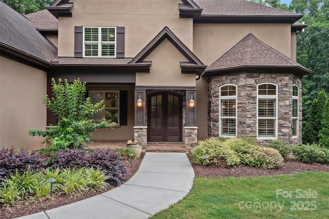 117 Walking Horse Trl, Davidson, NC 28036 - property entrance with stucco siding, stone siding, roof with shingles, and french doors