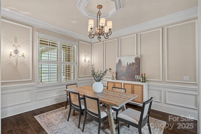 117 Walking Horse Trl, Davidson, NC 28036 - dining room featuring a decorative wall, a chandelier, dark wood-type flooring, and ornamental molding