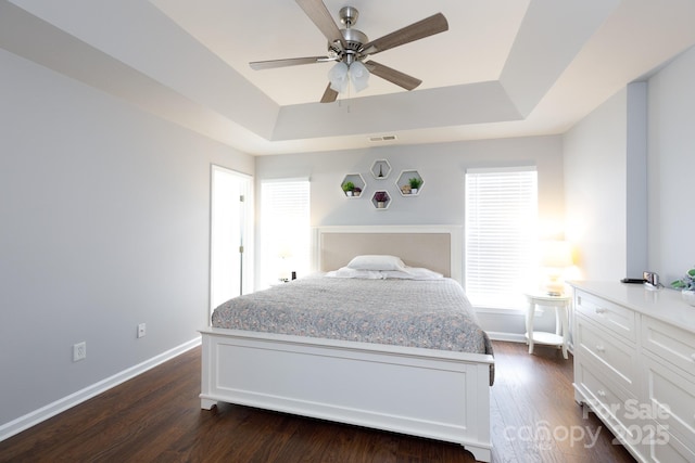 609 Atherton Way, Rock Hill, SC 29730 - bedroom featuring a tray ceiling, baseboards, dark wood finished floors, and ceiling fan