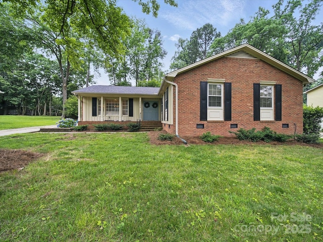 2026 Knell Dr, Charlotte, NC 28212 - single story home with brick siding, a front lawn, and board and batten siding