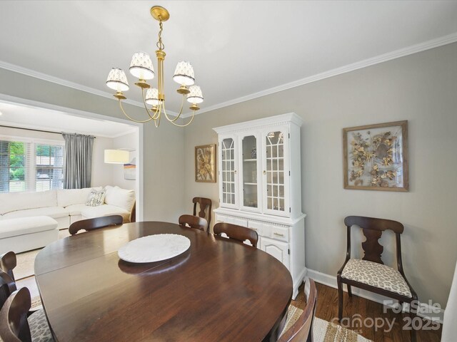 2026 Knell Dr, Charlotte, NC 28212 - dining space with a chandelier, ornamental molding, dark wood finished floors, and baseboards