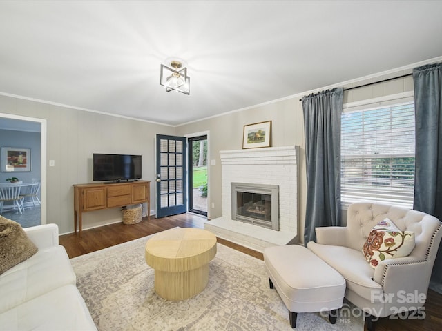 2026 Knell Dr, Charlotte, NC 28212 - living area with ornamental molding, wood finished floors, a fireplace, and baseboards