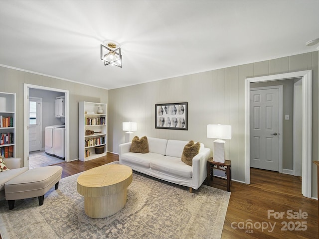 2026 Knell Dr, Charlotte, NC 28212 - living room with washing machine and clothes dryer, crown molding, wood finished floors, baseboards, and wooden walls