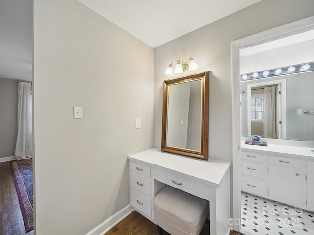 2026 Knell Dr, Charlotte, NC 28212 - bathroom with vanity, baseboards, and wood finished floors