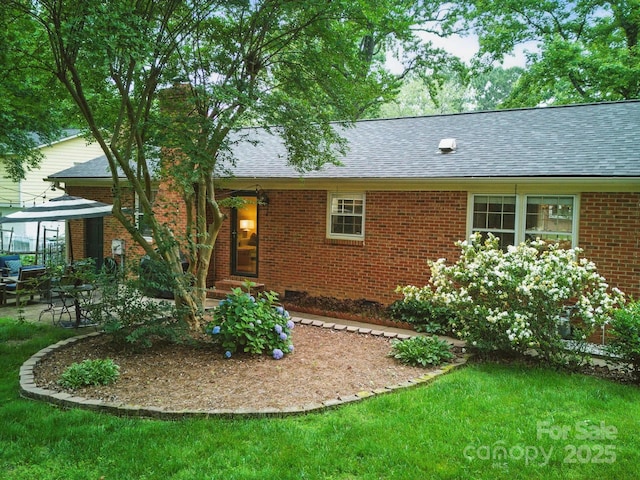 2026 Knell Dr, Charlotte, NC 28212 - view of front of property with roof with shingles, brick siding, a front yard, and a chimney