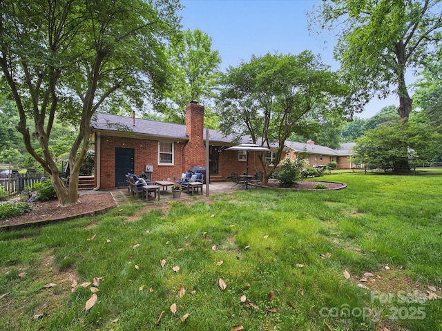 2026 Knell Dr, Charlotte, NC 28212 - rear view of property featuring a patio area, brick siding, and a chimney