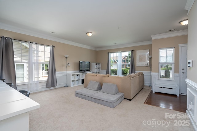 4915 Juniper Grove Ct SW, Concord, NC 28027 - living room featuring carpet flooring, crown molding, and wainscoting