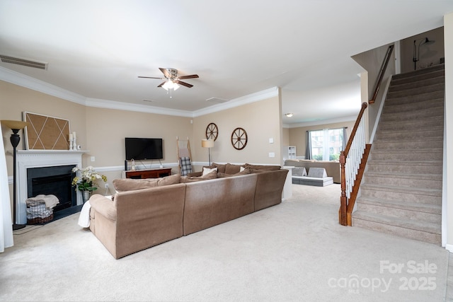 4915 Juniper Grove Ct SW, Concord, NC 28027 - carpeted living room featuring crown molding, stairs, ceiling fan, and a fireplace with flush hearth