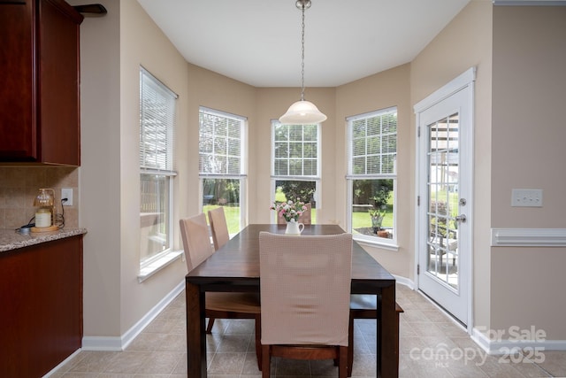 4915 Juniper Grove Ct SW, Concord, NC 28027 - dining space with baseboards and light tile patterned floors