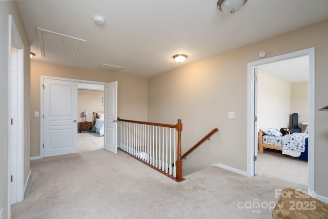 4915 Juniper Grove Ct SW, Concord, NC 28027 - hall with an upstairs landing, attic access, and carpet flooring