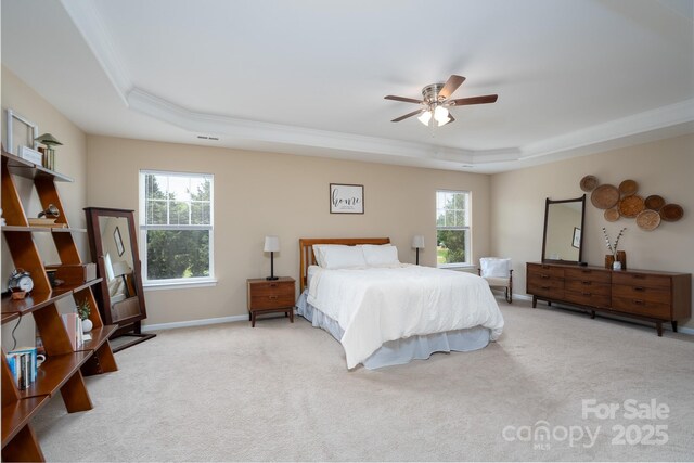 4915 Juniper Grove Ct SW, Concord, NC 28027 - carpeted bedroom featuring a raised ceiling, ornamental molding, and a ceiling fan