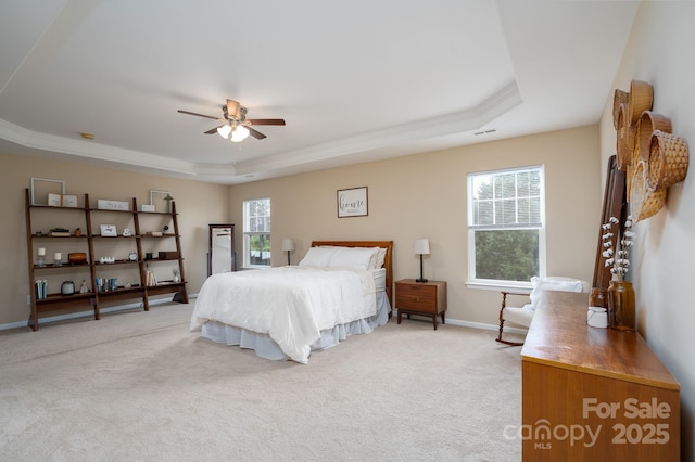 4915 Juniper Grove Ct SW, Concord, NC 28027 - bedroom featuring a tray ceiling, light carpet, and ceiling fan