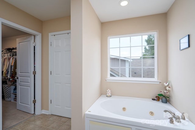 4915 Juniper Grove Ct SW, Concord, NC 28027 - full bath with a jetted tub, tile patterned flooring, a spacious closet, and recessed lighting