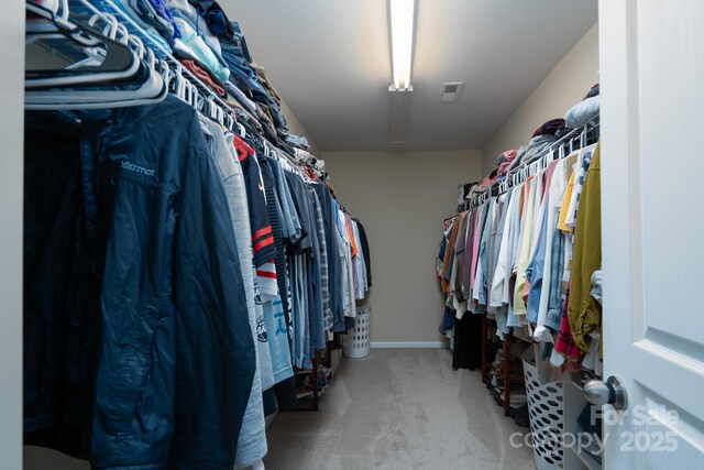 4915 Juniper Grove Ct SW, Concord, NC 28027 - walk in closet with carpet floors