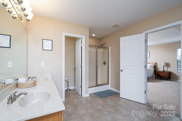 4915 Juniper Grove Ct SW, Concord, NC 28027 - full bath featuring double vanity, connected bathroom, a stall shower, tile patterned floors, and a chandelier