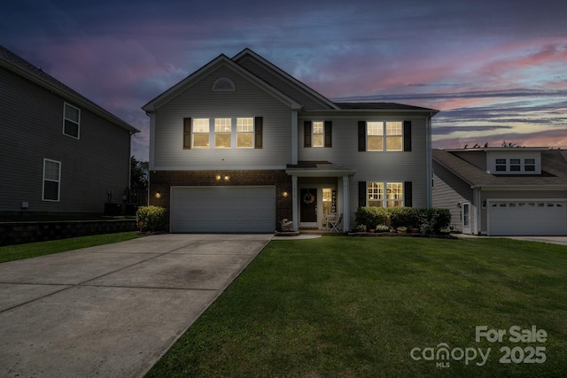 4915 Juniper Grove Ct SW, Concord, NC 28027 - traditional home featuring a garage, driveway, a front lawn, and brick siding