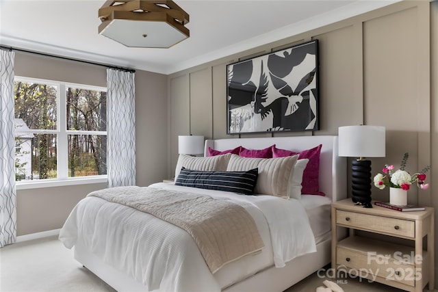 2238 Endeavor Run, Charlotte, NC 28269 - bedroom featuring multiple windows, baseboards, and carpet floors