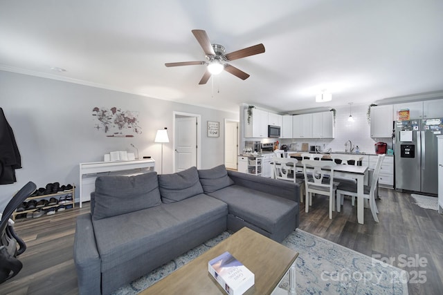 2302 Douglas Rd, Lancaster, SC 29720 - living area with a ceiling fan, ornamental molding, and dark wood-style flooring