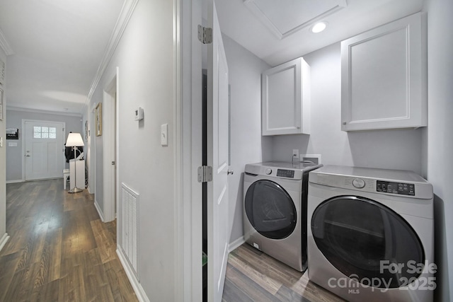 2302 Douglas Rd, Lancaster, SC 29720 - washroom featuring cabinet space, washer and dryer, wood finished floors, crown molding, and attic access