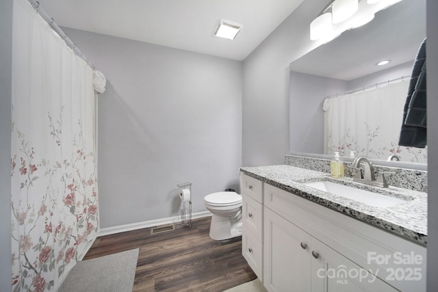 2302 Douglas Rd, Lancaster, SC 29720 - full bath with vanity, wood finished floors, and curtained shower