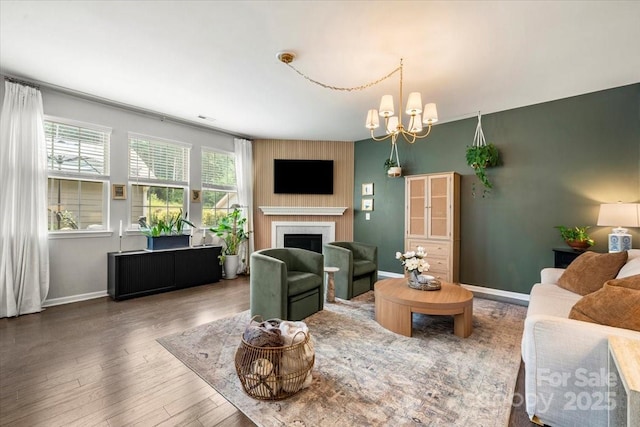 15515 Laverack Ln, Davidson, NC 28036 - living area with a fireplace, a chandelier, and wood finished floors