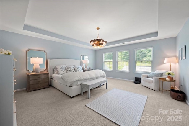 15515 Laverack Ln, Davidson, NC 28036 - bedroom with a raised ceiling, carpet, and a chandelier