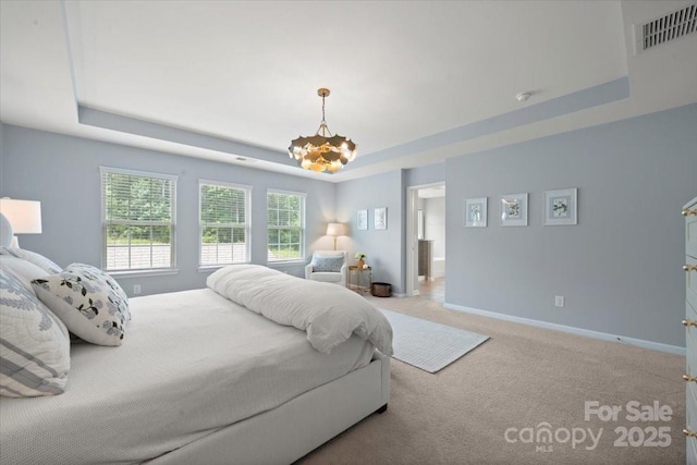 15515 Laverack Ln, Davidson, NC 28036 - carpeted bedroom with a tray ceiling and a chandelier