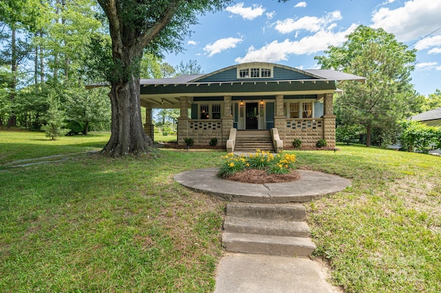 409 S Grove St, Lincolnton, NC 28092 - view of front of property featuring a porch, a front yard, and stone siding