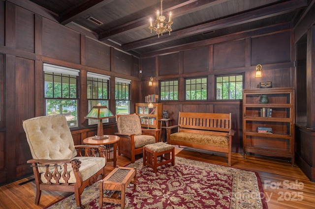 409 S Grove St, Lincolnton, NC 28092 - sitting room featuring wooden ceiling with exposed beams, wood finished floors, a chandelier, and wooden walls