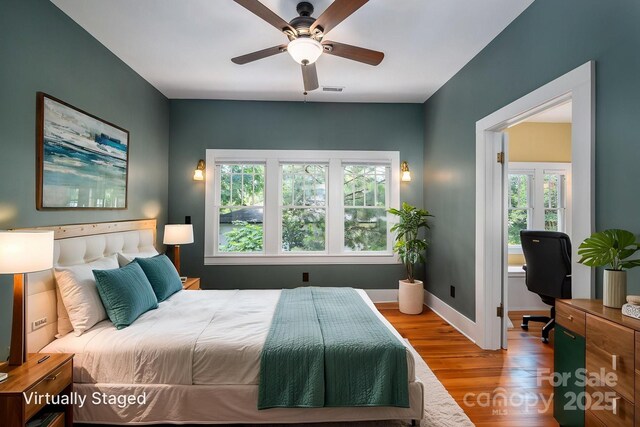 409 S Grove St, Lincolnton, NC 28092 - bedroom featuring wood finished floors, an office area, baseboards, and ceiling fan
