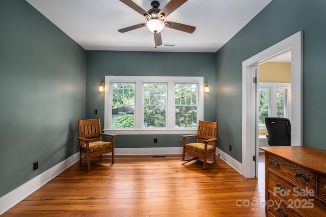 409 S Grove St, Lincolnton, NC 28092 - sitting room with a desk, ceiling fan, hardwood / wood-style floors, and baseboards