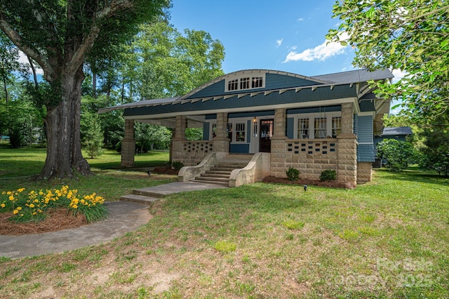 409 S Grove St, Lincolnton, NC 28092 - view of front of home with a porch, a front yard, metal roof, and a standing seam roof