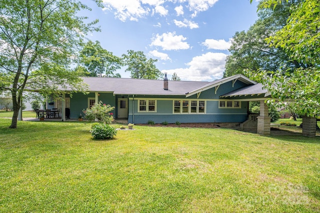409 S Grove St, Lincolnton, NC 28092 - rear view of property featuring a lawn