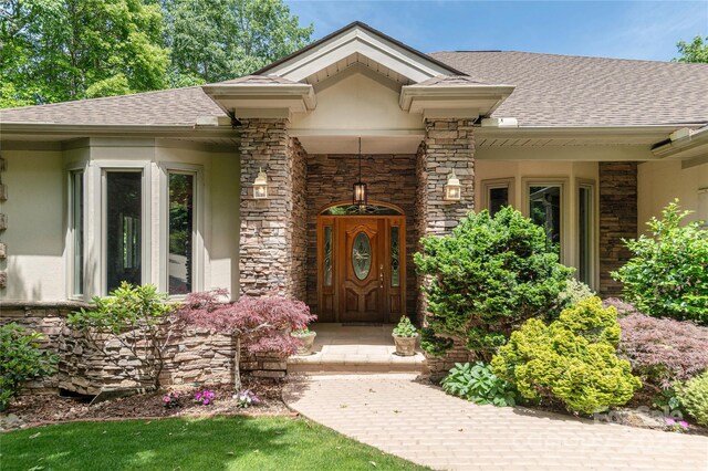 201 Kawani Ln, Brevard, NC 28712 - view of exterior entry featuring stone siding and a shingled roof