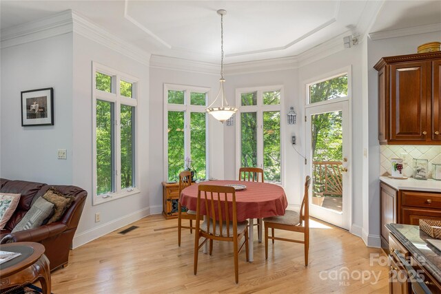 201 Kawani Ln, Brevard, NC 28712 - dining room featuring light wood-style floors, baseboards, and ornamental molding