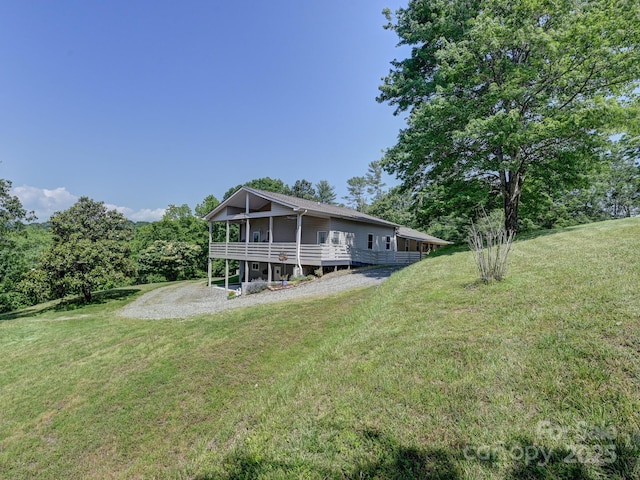 90 Coates Rd, Marshall, NC 28753 - rear view of property featuring a yard and a sunroom