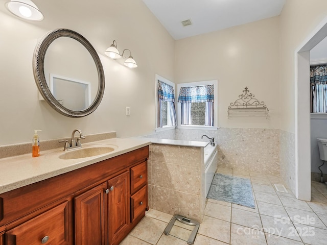 90 Coates Rd, Marshall, NC 28753 - full bathroom featuring vanity, a bath, tile patterned floors, and toilet