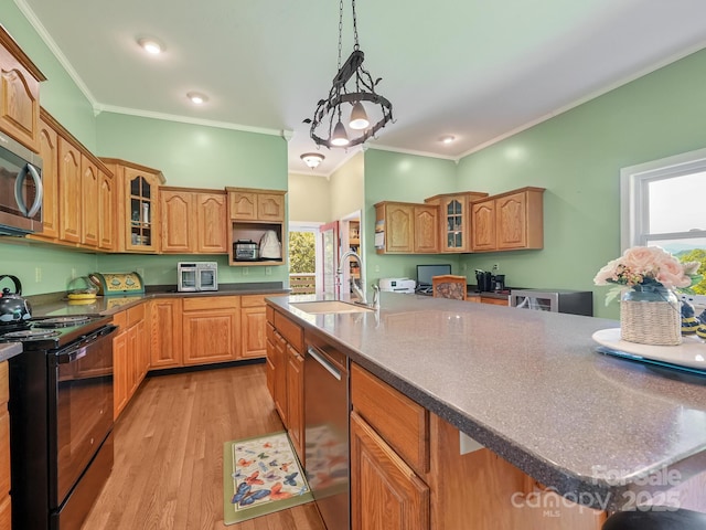 90 Coates Rd, Marshall, NC 28753 - kitchen featuring appliances with stainless steel finishes, a sink, healthy amount of natural light, ornamental molding, and glass insert cabinets