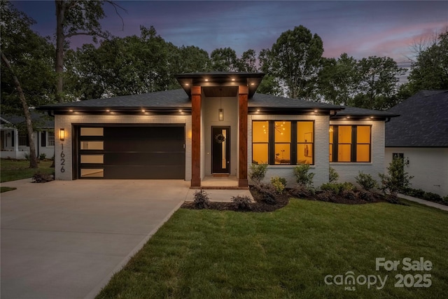 1626 Burtonwood Cir, Charlotte, NC 28212 - prairie-style house featuring a garage, brick siding, driveway, and a yard