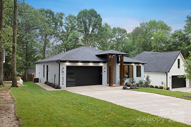 1626 Burtonwood Cir, Charlotte, NC 28212 - view of front facade featuring concrete driveway, a front yard, an attached garage, and a shingled roof