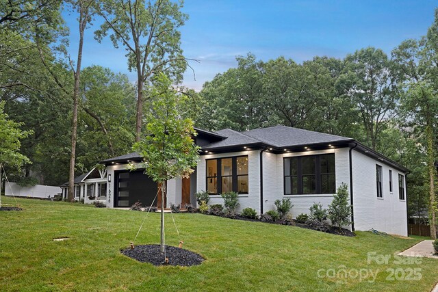 1626 Burtonwood Cir, Charlotte, NC 28212 - view of front of house featuring an attached garage, brick siding, and roof with shingles