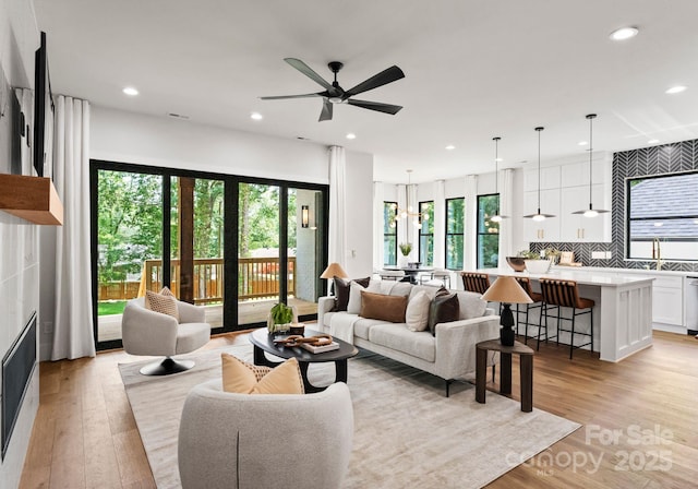 1626 Burtonwood Cir, Charlotte, NC 28212 - living area featuring healthy amount of natural light, light wood-style floors, ceiling fan, and recessed lighting